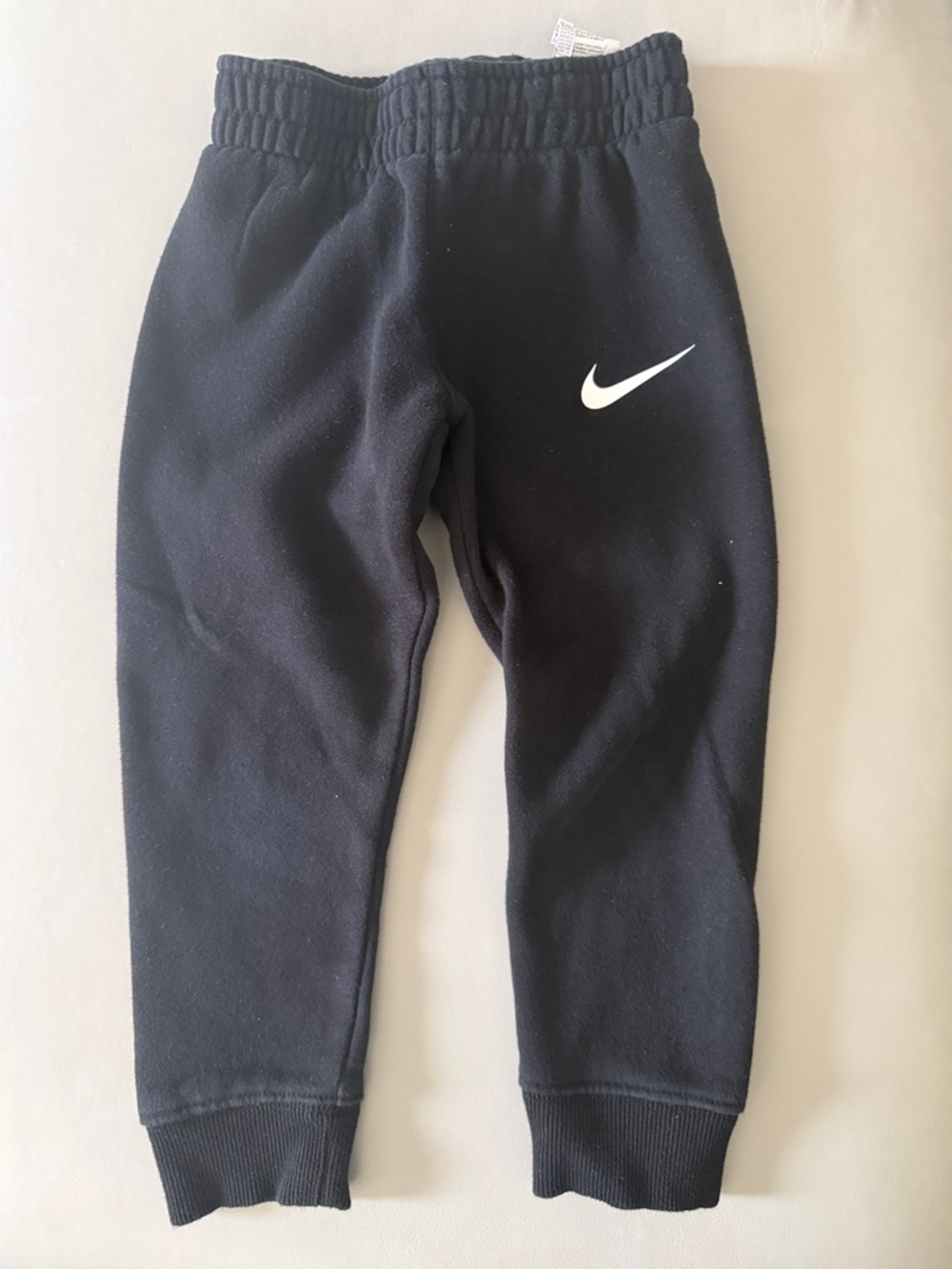 Nike Kids Black Sweatpants with White Swoosh